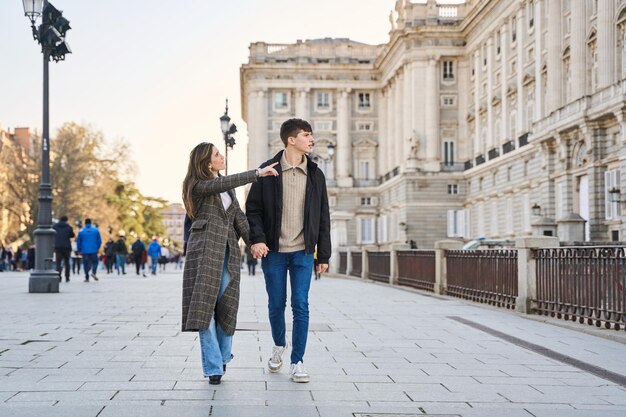 couple in love strolling around famous places in madrid sightseeing