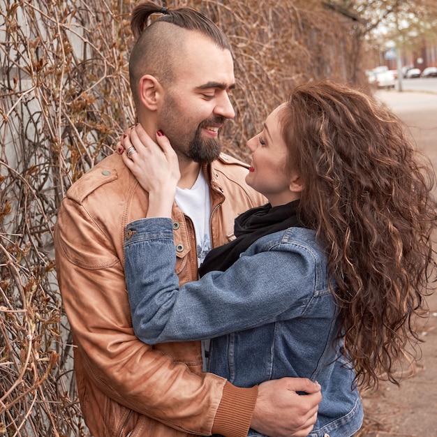 Couple in love talking standing on the street of the city .the concept of relationships.