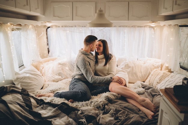 Photo couple in love in a trailer