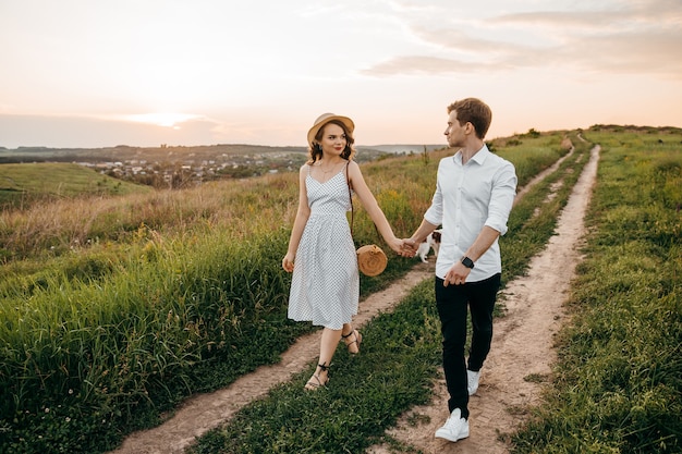 Couple in love walking the hills holding hands