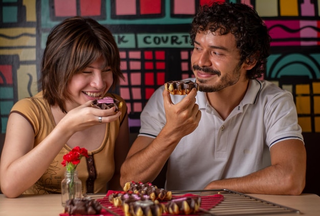 Photo couple in love with valentine themed cookies