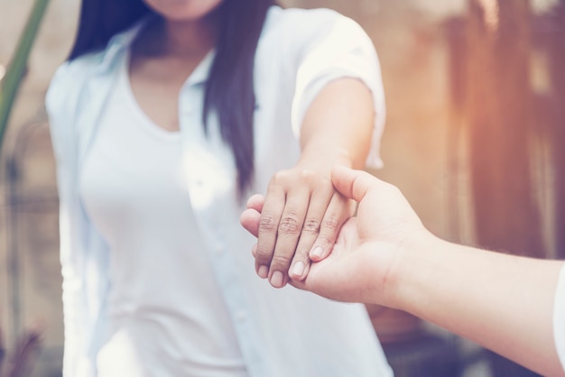 Couple lover touching hands with love.