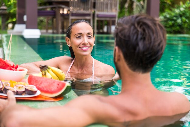 Couple of lovers in a beautiful villa with swimming pool