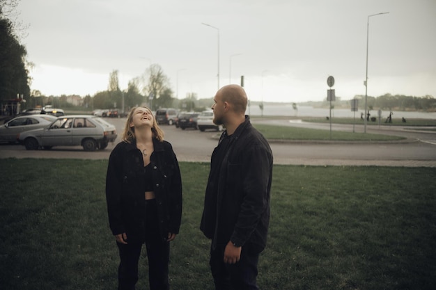 A couple of lovers happily walking in the rain