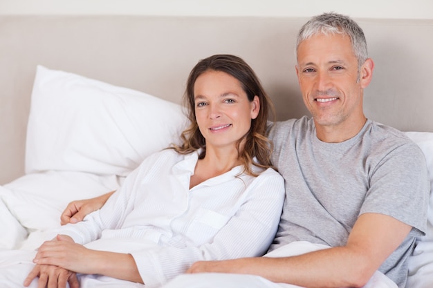 Couple lying on a bed