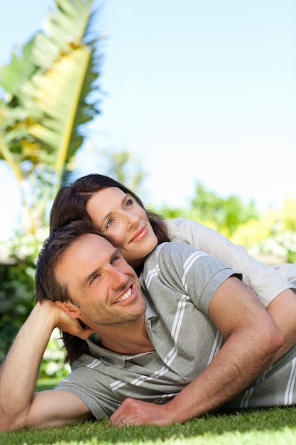 Couple lying down in the garden