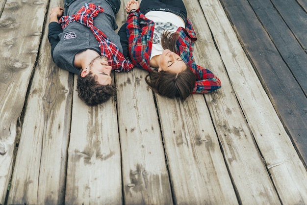 Couple lying in a seaport