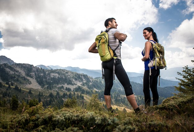 Couple making trekking on the mountain