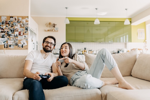 Couple of man and woman playing a video game