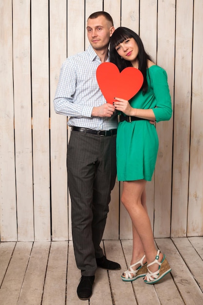 Couple of man and woman with shape of red heart. Love in Valentine's day.