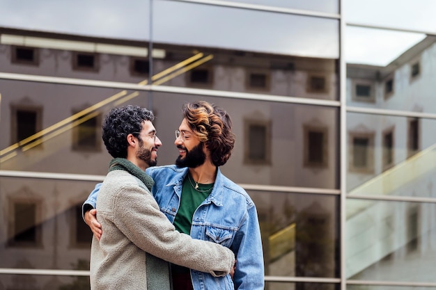 Couple of men hugging looking into eyes with love