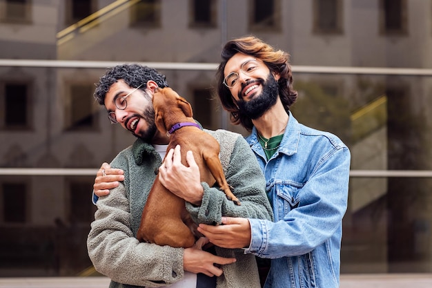 Couple of men laughing happy with a naughty dog