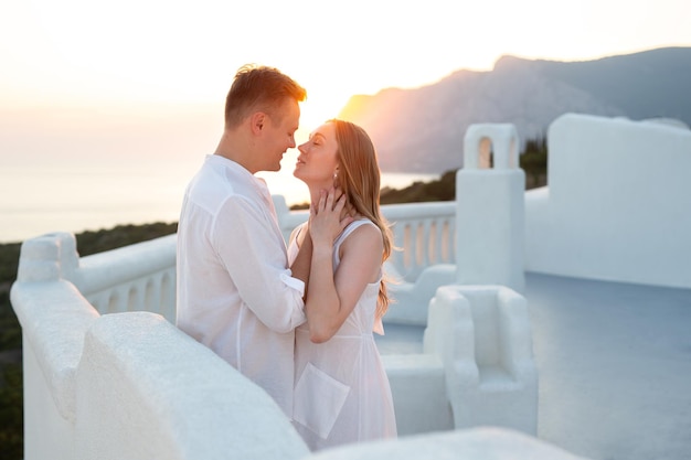 Couple of men and women in love on vacation in Santorini Greece