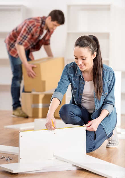 Couple moving in new home house.