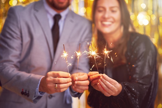 Photo couple at new year eve party with 2023 sparklers