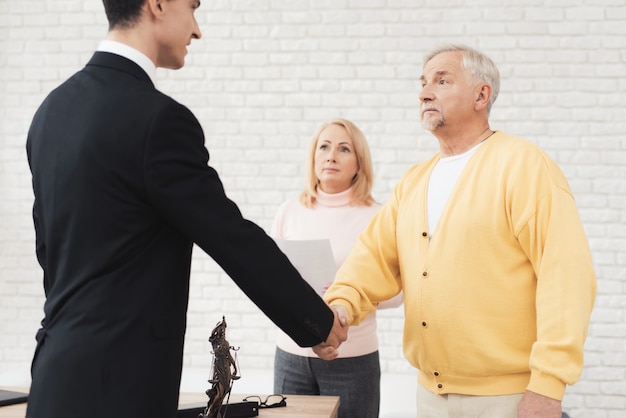 A couple of old people came to see a realtor.