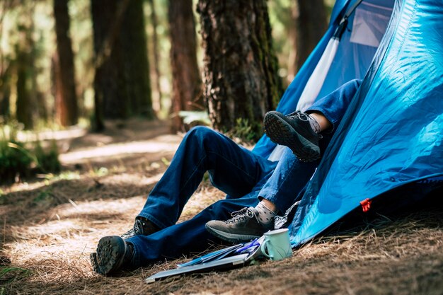 couple in outdoor leisure  activity inside a tent in the forest