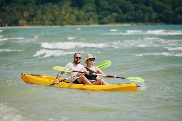 Couple paddling kayak