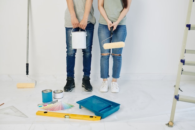 Couple painting house