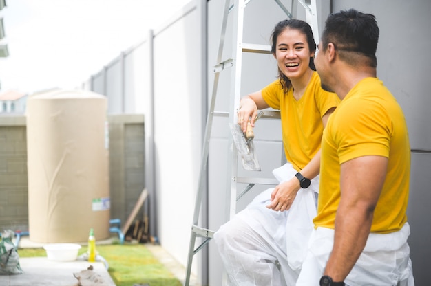 Couple painting the wall, lovely concept