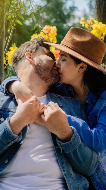 Couple in a park kissing.