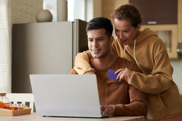 Couple paying online for delivery