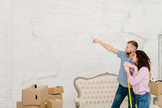 Couple planning renovation during cleaning