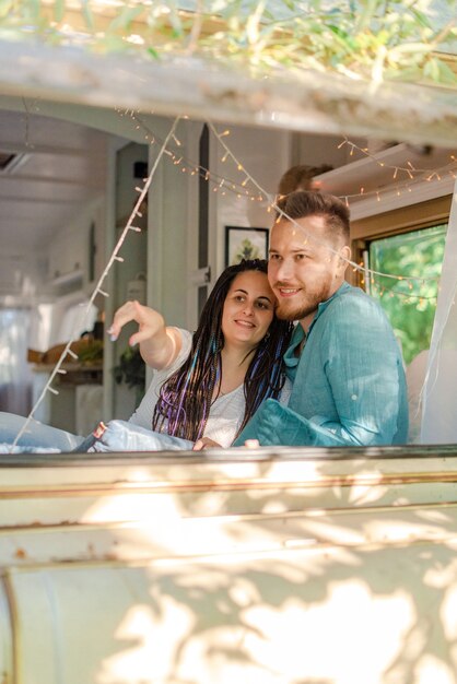 Couple planning a trip in the trailer