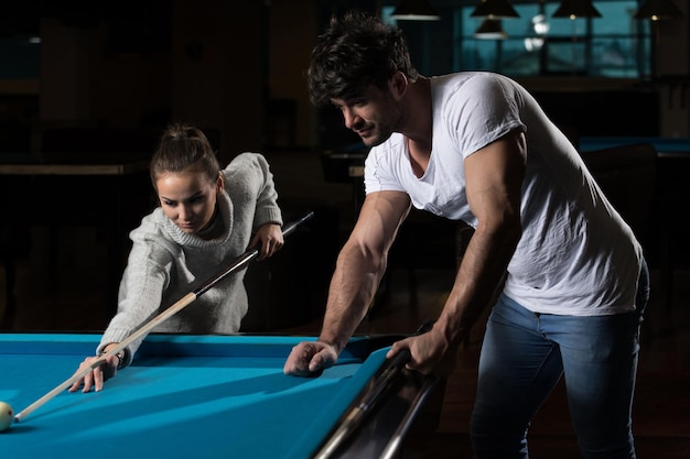 Couple Playing Billiard