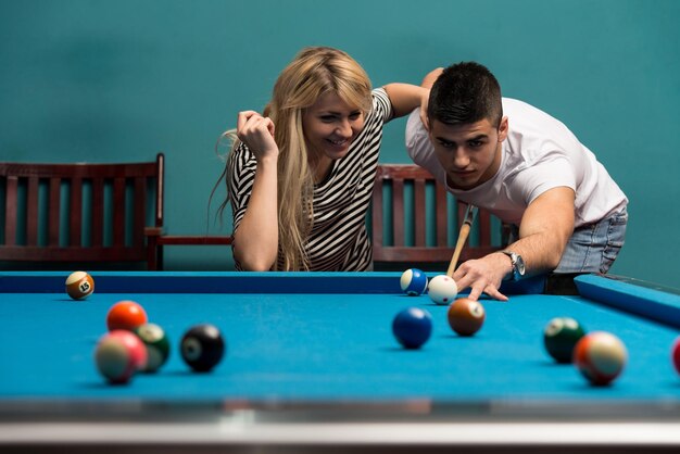 Couple Playing Billiard