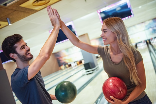 Couple playing bowling