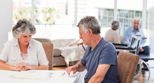 Couple playing dominos