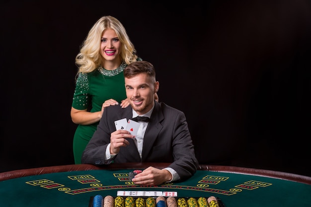 Couple playing poker at the table