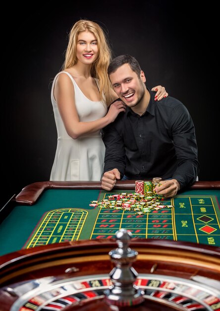 Couple playing roulette wins at the casino