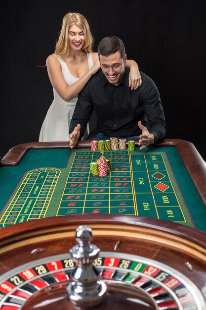 Couple playing roulette wins at the casino