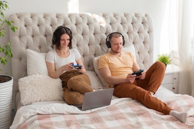 Couple playing videogames at home