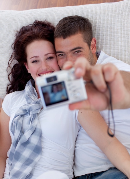 Couple playing with a camera