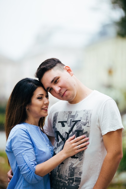 couple posing on the streets of a European city in summer weather.