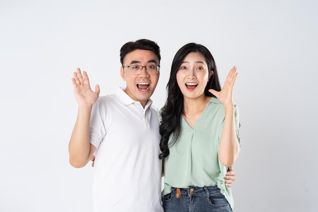 a couple posing on a white background