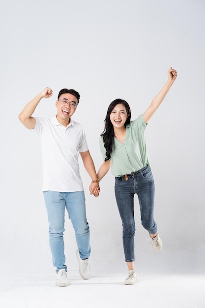 a couple posing on a white background