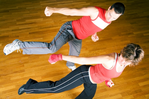 couple practicing martial arts