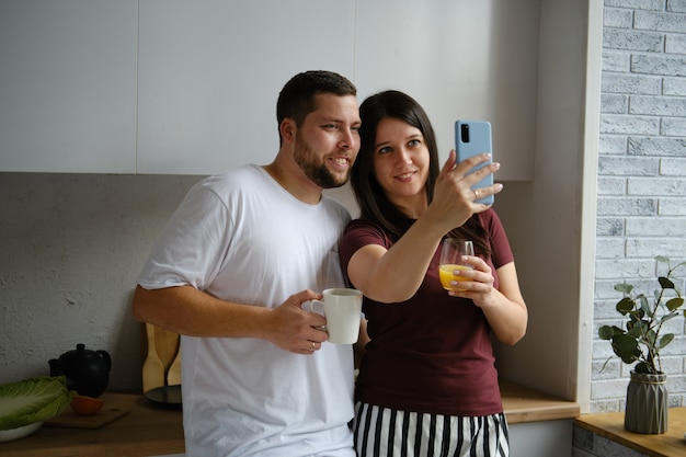 Couple preparing breakfast and chatting