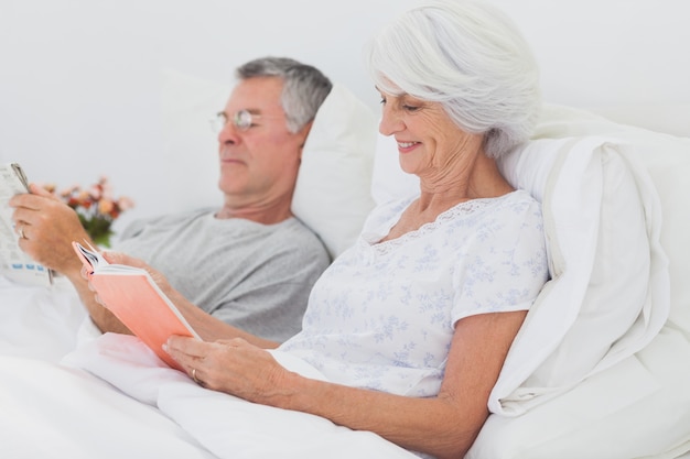 Couple reading together in bed