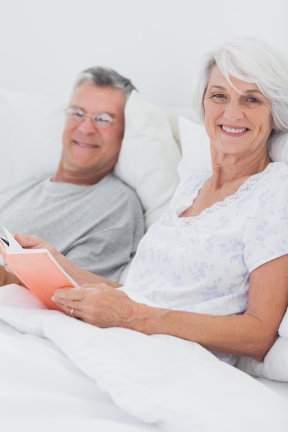 Couple reading together in bed