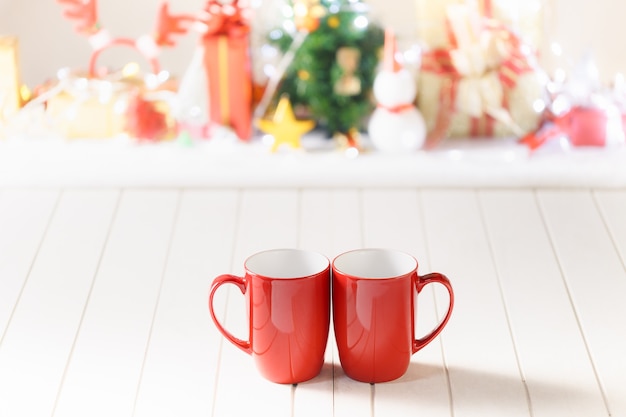 Couple red mugs on Christmas festival object background