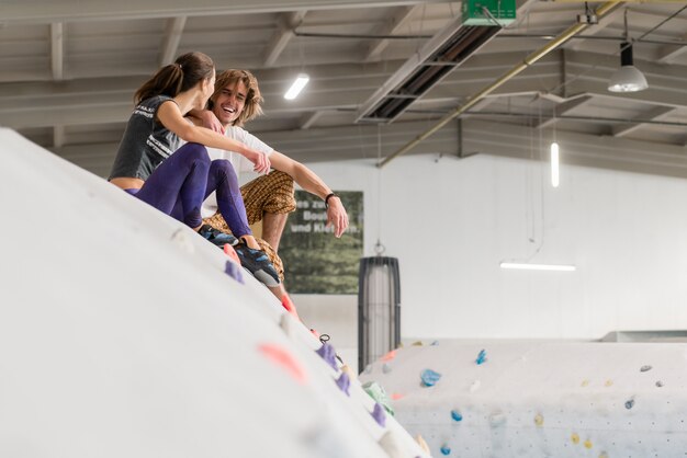 Couple relaxing after bouldering