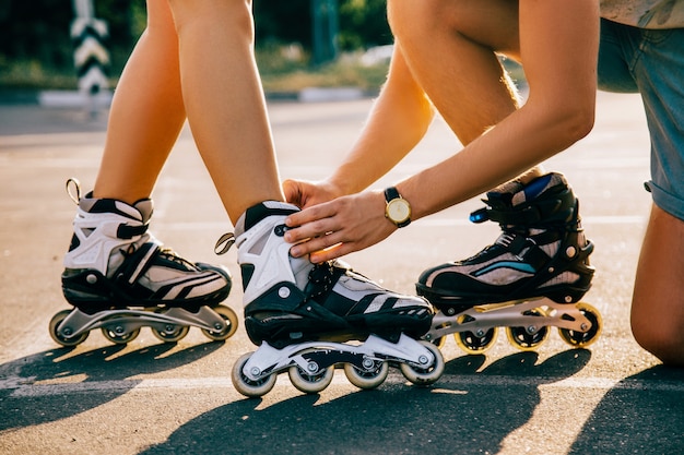 A couple roller-skating at sunset