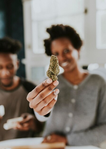 A couple rolling a joint