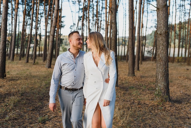 Couple On Romantic Country Walk Through Woodland