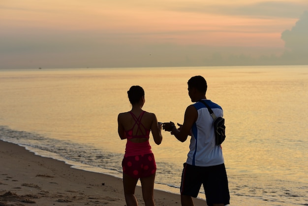 couple running on the beach